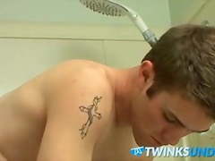 Athletic guy Bryce Corbin wanking his big cock in the shower